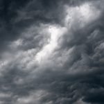 Dark storm clouds gathering over Garešnica, creating a moody and dramatic landscape scene.