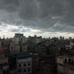 Stormy clouds loom over the bustling cityscape of Dhaka, Bangladesh.