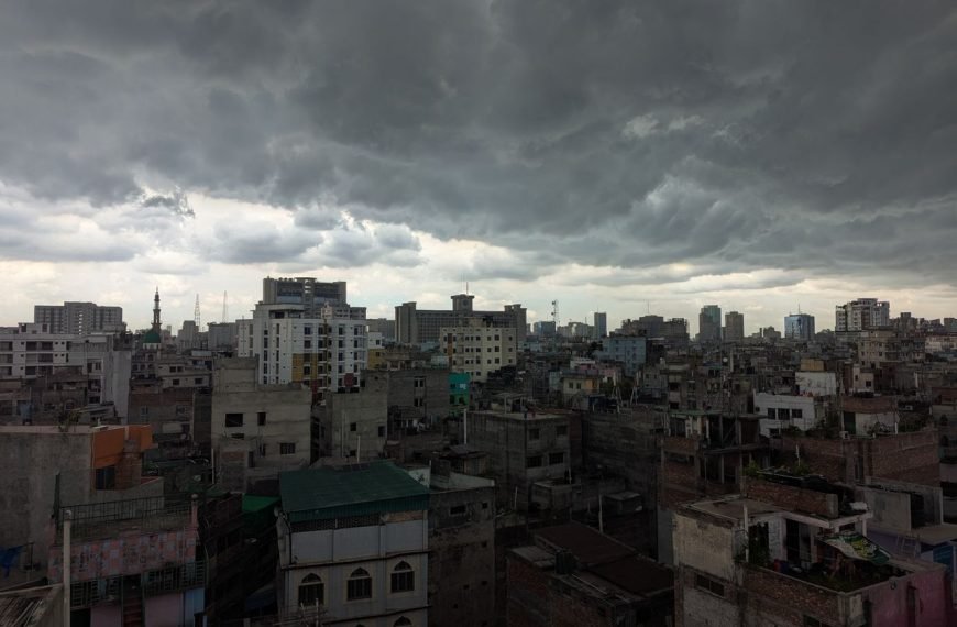Stormy clouds loom over the bustling cityscape of Dhaka, Bangladesh.