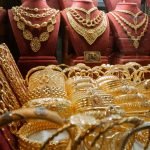 Luxurious gold jewelry display featuring necklaces and bracelets in an Istanbul store.